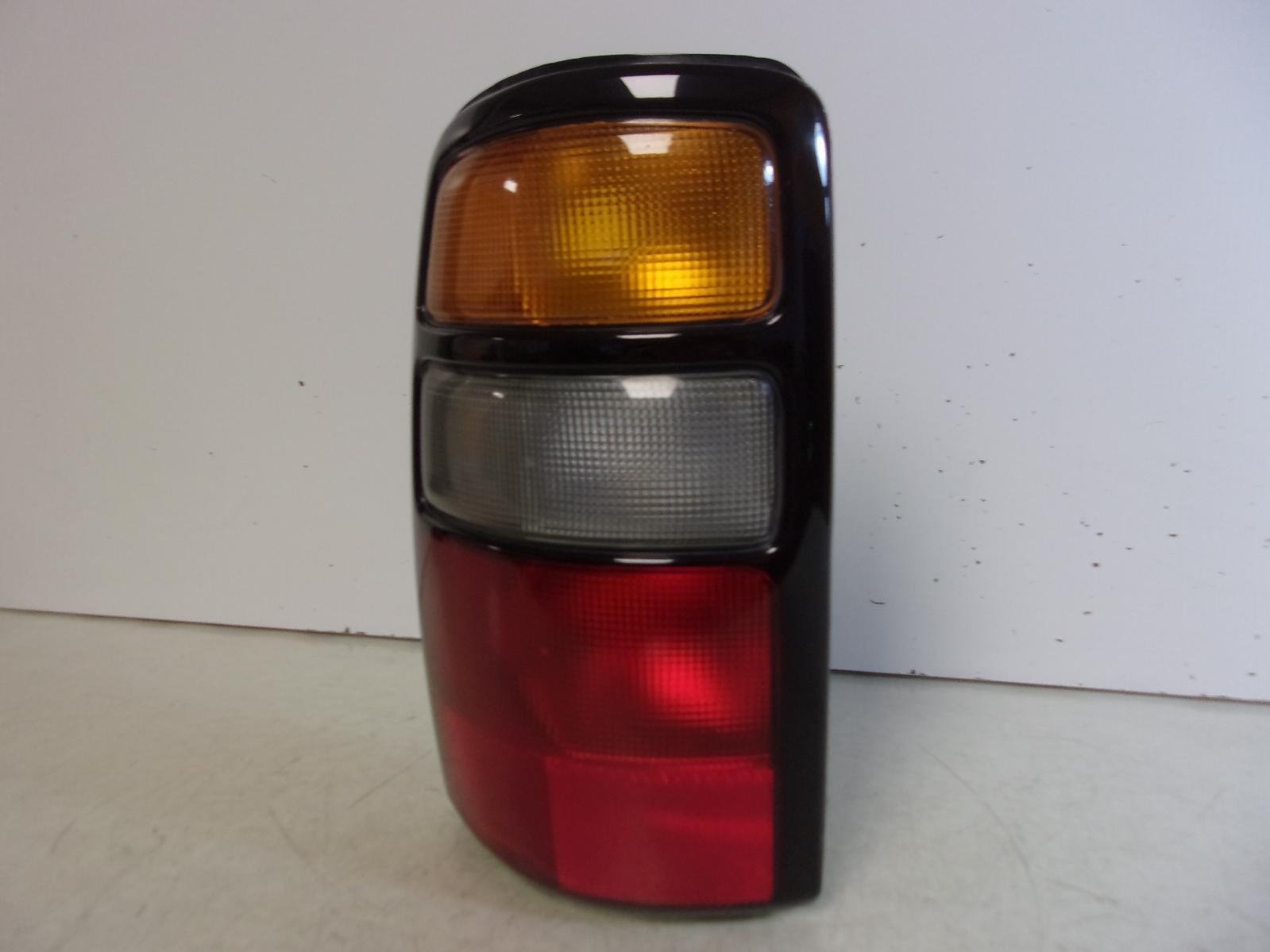 2004 2005 2006 Chevrolet Suburban / Tahoe / GMC Yukon Driver LH Tail Light OEM