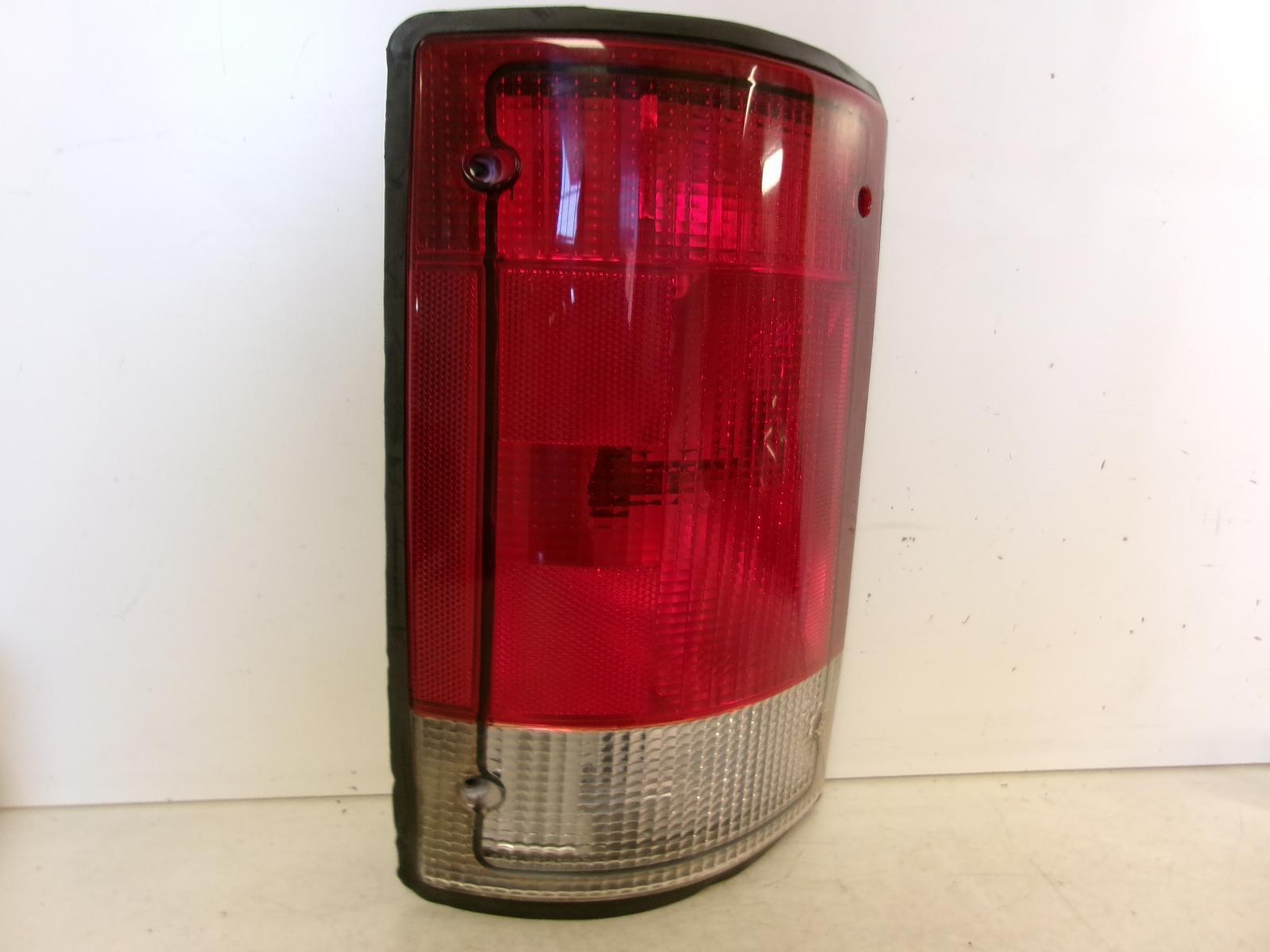 1995 - 2004 Ford E150 E250 E350 Driver LH Outer Quarter Panel Tail Light OEM