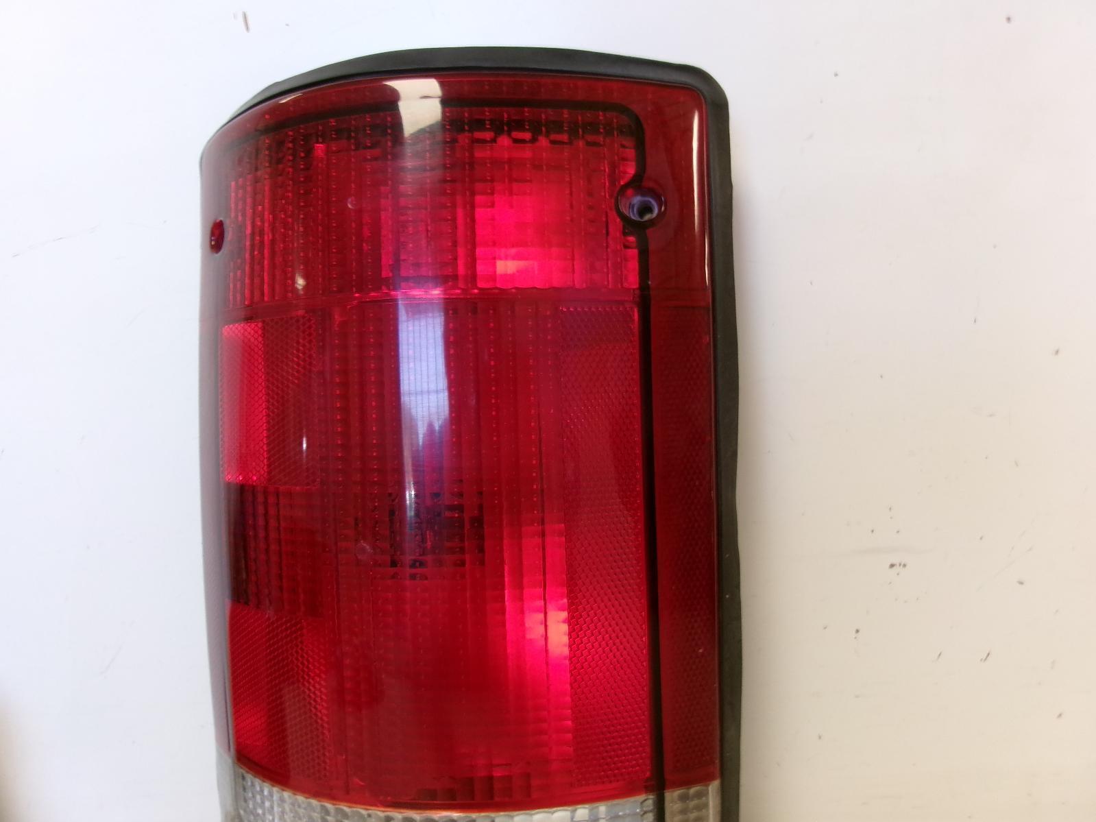 1995 - 2004 Ford E150 E250 E350 Driver LH Outer Quarter Panel Tail Light OEM