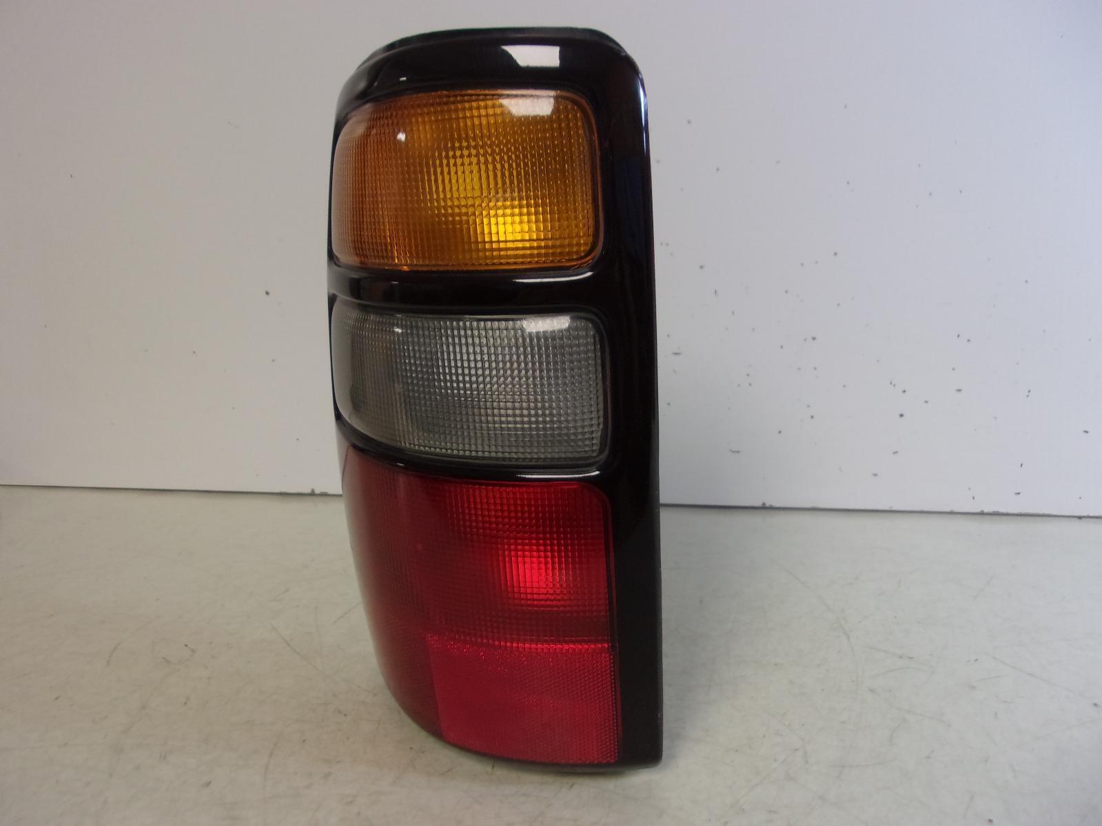 2004 2005 2006 Chevrolet Suburban / Tahoe / GMC Yukon Driver LH Tail Light OEM