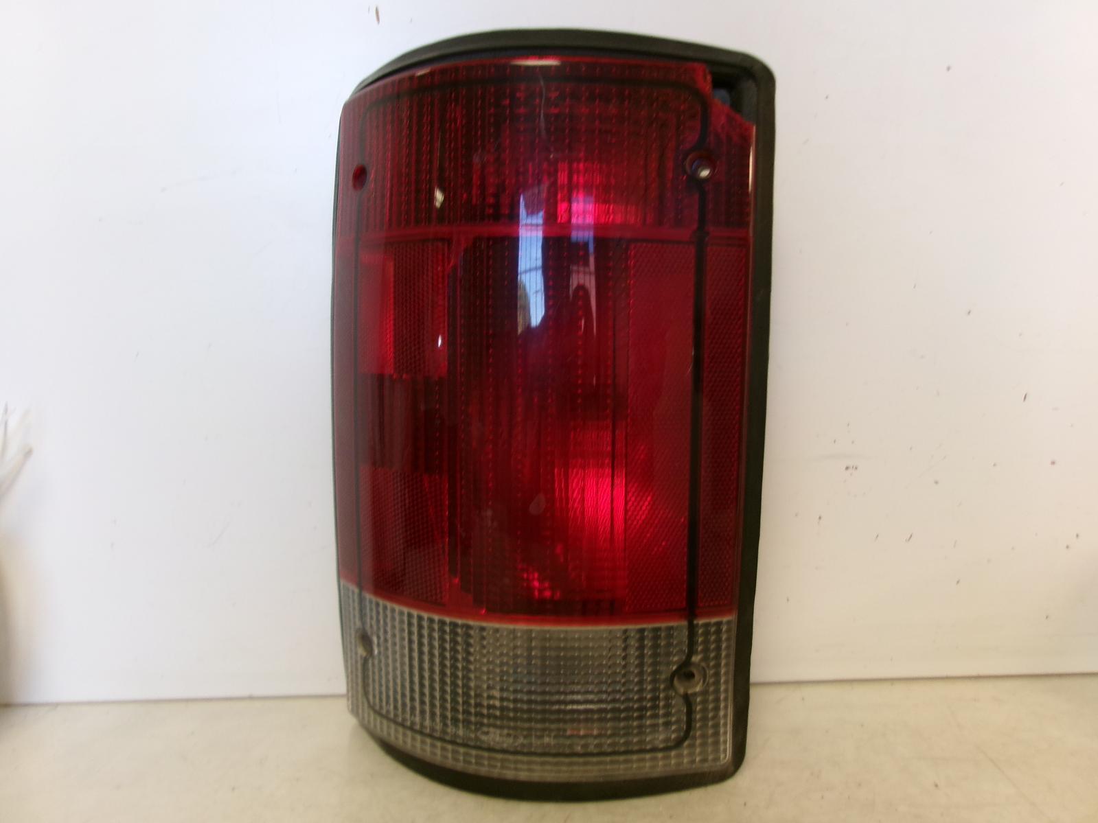 1995 - 2004 Ford E150 E250 E350 Driver LH Outer Quarter Panel Tail Light OEM