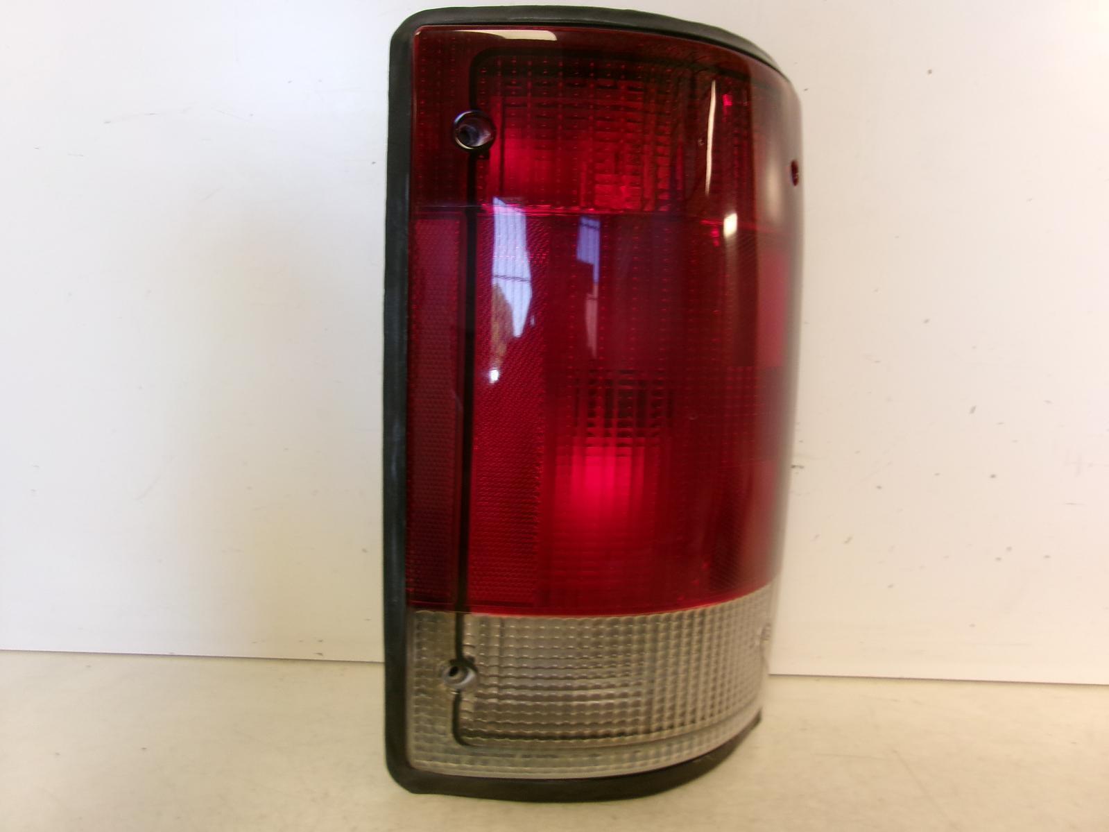 1995 - 2004 Ford E150 Passenger RH Outer Quarter Panel Tail Light OEM