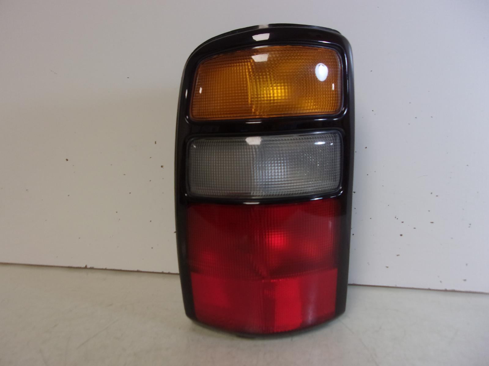 2004 2005 2006 Chevrolet Suburban / Tahoe / GMC Yukon Driver LH Tail Light OEM